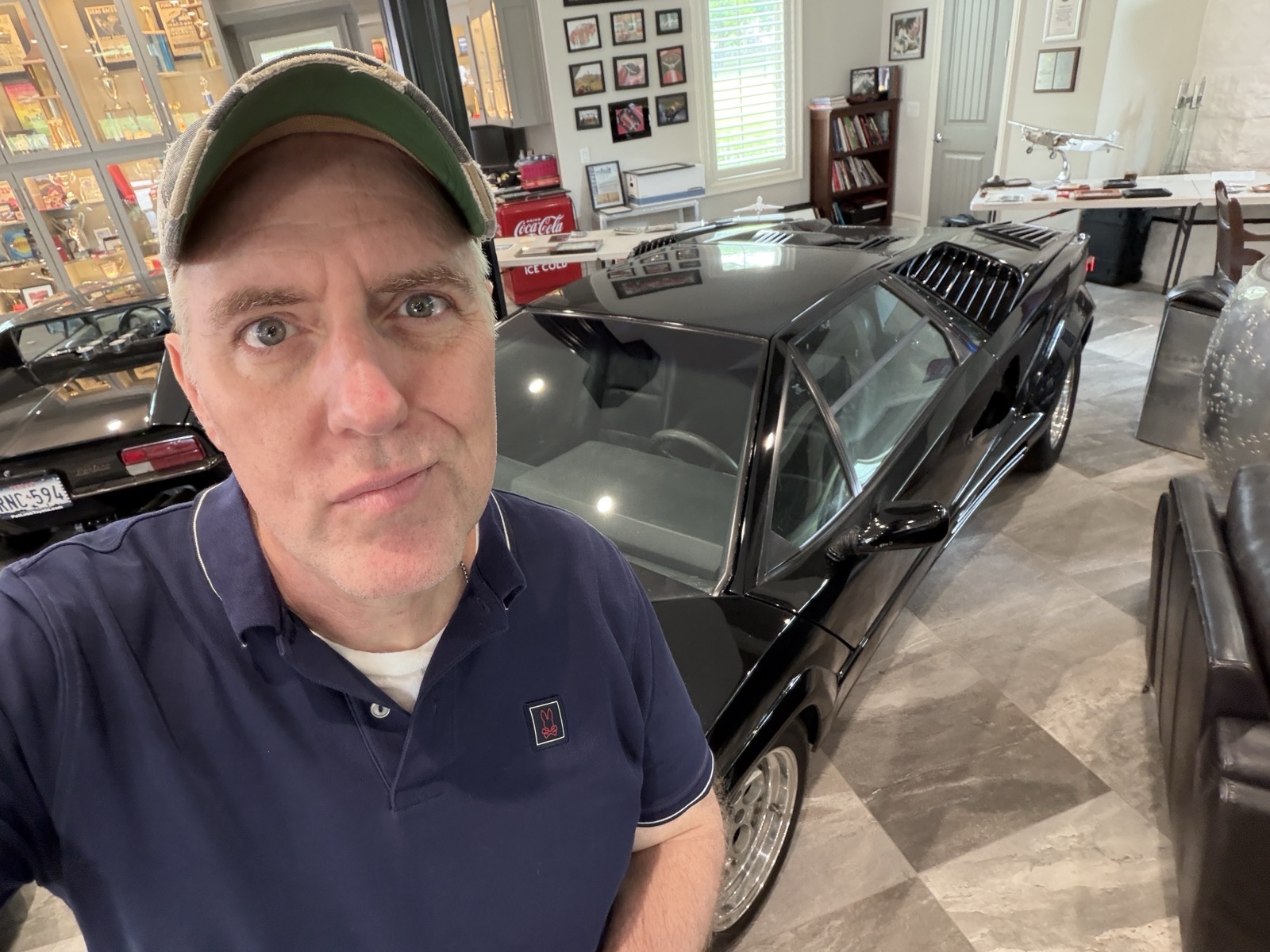 Chance McClain with a black Lamborghini Countach